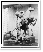 Anna Hyatt Huntington working on the Torch Bearers, a sculpture of a man, lying on ground, passing a torch to man on horseback, Vintage Wall Art