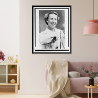 Maureen Connolly, head-and-shoulders portrait, facing slightly right, holding championship cup and two tennis rackets, Antique Print