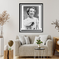 Maureen Connolly, head-and-shoulders portrait, facing slightly right, holding championship cup and two tennis rackets, Antique Print