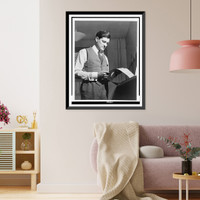 Historic Framed Print, [Eric Sevareid reads document from teletype],  17-7/8" x 21-7/8"