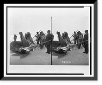 Men with poles and two large pieces of whale on shore, Historic Print