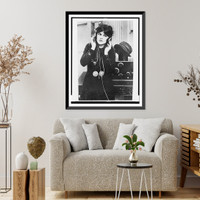 Anne Cornwall, half-length portrait, standing, facing front, listening to radio in Paramount studio, Los Angeles Classic, Antique Print