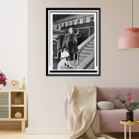 Christine Jorgensen, full-length portrait, facing front, waving as she boards an airplane, at Copenhagen, Denmark, Historic Print
