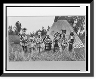 Group of Siksika (Blackfeet) men and one woman singing in front of tipi, Vintage Poster