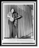 Pete Seeger, full-length portrait, performing on stage at Yorktown Heights High School, Yorktown, N.Y..World Journal Tribune photo by James Kavallines, Vintage Print