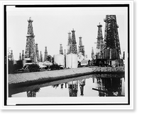 Historic Framed Print, [Oil wells including Donley well no. 1, and a Kirkpatrick well],  17-7/8" x 21-7/8"