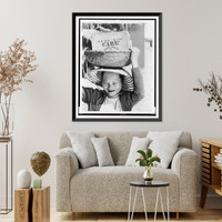 Historic Framed Print, [Vietnamese refugee woman carries basket on her head with box labeled CARE],  17-7/8" x 21-7/8"
