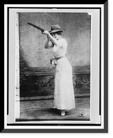 Historic Framed Print, [Woman posed with shotgun for trapshooting],  17-7/8" x 21-7/8"