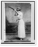 Historic Framed Print, [Woman posed with shotgun for trapshooting],  17-7/8" x 21-7/8"