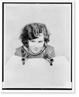 Historic Framed Print, [Miss Grace Stockman with President Andrew Jackson's dueling pistols, at the National Museum],  17-7/8" x 21-7/8"