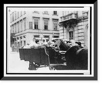Historic Framed Print, [Man lying down on wagon seat, two women in back of wagon, Hungary],  17-7/8" x 21-7/8"