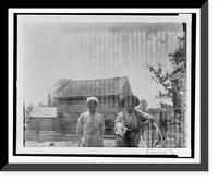 African American man and woman, half-length portrait, standing in barnyard(?), Vintage Wall Art