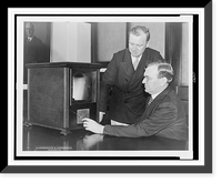 Secretary of Labor William N. Doak and his secretary, W.W. King, examining a television receiver in their office in Washington, D.C..photo by Underwood & Underwood, Antique Print