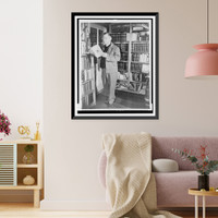 Erle Stanley Gardner, full-length portrait, standing, looking at a book in his library, near Temecula, California, Antique Wall Art