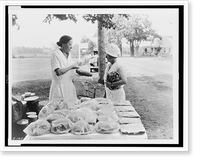Historic Framed Print, [Woman selling baked goods by roadside],  17-7/8" x 21-7/8"