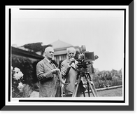 Thomas Edison and George Eastman, standing, full-length, with motion picture camera, Vintage Poster