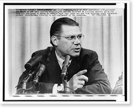 Defense Secretary Robert McNamara seated at news conference, Vintage Poster
