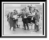 Police give first city doles to unemployed. Police distributing eggs and bread to city's needy at E. 104th St. station house today.by Telegram staff photographer. Classic, Historic Print