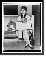 Audrey Hepburn, full-length portrait, seated at Idlewild Airport, facing left, holding her dog, Assam, Vintage Wall Art