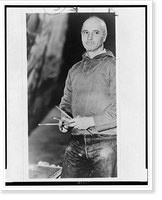 Rockwell Kent, three-quarter length portrait, facing left, holding paint brushes, Antique Print