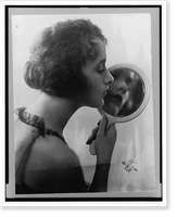 Historic Framed Print, [Constance Talmadge, head-and-shoulders portrait, facing right, looking into mirror],  17-7/8" x 21-7/8"