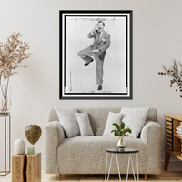 Milton Berle, full-length portrait, posed standing on one leg, with mouth wide open, Antique Poster