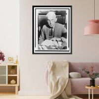 Dr. Guy Stanton Ford, half-length portrait, seated at desk, reading book, Vintage Poster