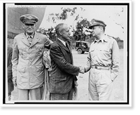 Under Secretary of War Robert Patterson shaking hands with General Douglas MacArthur in New Guinea; Lieutenant General William S. Knudsen on left, Vintage Poster