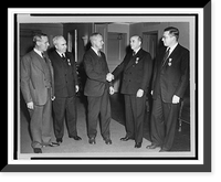 Under Secretary of War Robert Patterson shaking hands with E.F. McGrady; J.H. Amberg and M.J. Madigan on his left and H.C. Petersen on his right Classic, Antique Poster