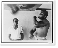Muhammad Ali, formerly Cassius Clay, works out on light bag in Miami Classic, Vintage Print