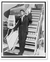 Historic Framed Print, [Muhammad Ali, formerly Cassius Clay, disembarks from airplane at JFK International Airport in New York],  17-7/8" x 21-7/8"