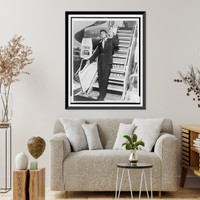 Historic Framed Print, [Muhammad Ali, formerly Cassius Clay, disembarks from airplane at JFK International Airport in New York],  17-7/8" x 21-7/8"