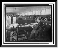 Man seated at table examining birds in the Division of Birds at the Natural History Building, Antique Print