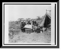 Edgar A. Mearns with Childs Frick and three men seated around makeshift table at campsite during Frick expedition to Abyssinia, Historic Reproduction