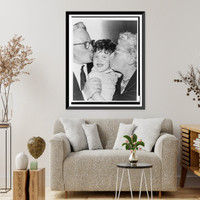 Mr. and Mrs. Julius Galin greet their granddaughter, Debbie Schneer, with kisses.World Telegram & Sun photo by Roger Higgins, Antique Print