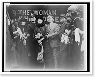 Historic Framed Print, [Mildred Harris Chaplin, full-length portrait, standing in crowd, facing front, guarded by a policeman],  17-7/8" x 21-7/8"