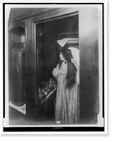 Woman combing her hair in ladies' toilet room, tourist sleeper, in railroad car, Antique Poster