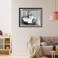 Historic Framed Print, Manzanar, Calif., 1942. Dr. James Coto, Los Angeles physician and surgeon, examining an elderly patient in the emergency hospital at the War relocation authority center for evacuees of Japanese ancestry,  17-7/8" x 21-7/8"