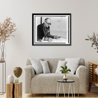 Le Corbusier, half-length portrait, seated at desk, facing right, working on drawing, Antique Wall Art