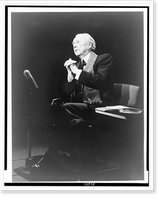 Frank Lloyd Wright, full-length portrait, seated, facing left, during interview, on The Mike Wallace Interview" television program" Classic, Historic Reproduction
