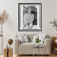 Frank Lloyd Wright, three-quarter length portrait, seated, facing front, outside the U.S. Capitol building Classic, Vintage Poster