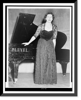 Micheline Ostermeyer, full-length portrait, standing, facing front, in front of a piano, Historic Print
