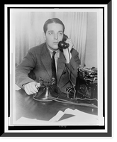 Ring Lardner, Jr., half-length portrait, seated, talking on telephone, Vintage Poster