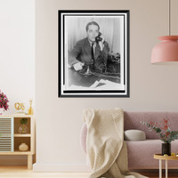 Ring Lardner, Jr., half-length portrait, seated, talking on telephone, Vintage Poster