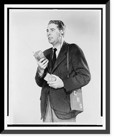 Don Hollenbeck, half-length portrait, facing left, modelling new walkie-talkie set, Antique Poster