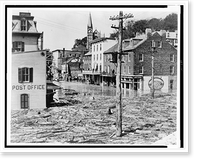 Flooded street scene in Harper's Ferry, with post office in foreground, drugstore, other buildings, and church steeple in background, Antique Wall Art