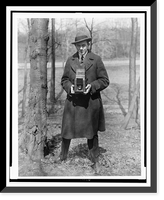 John Steel, full-length portrait, holding camera in a wooded area Classic, Historic Reproduction
