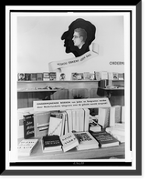 Exhibit of chiefly anti-communist and anti-Jewish propaganda, with books on table and shelves, The Hague, Netherlands, Antique Print