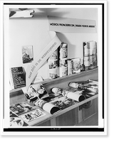 Exhibit of chiefly anti-communist and anti-Jewish propaganda, with book, photographs, and posters on shelves, The Hague, Netherlands Classic, Historic Print