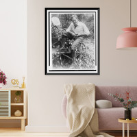 John Charles Thomas, singer, full-length portrait, sitting on log bench, whittling a small branch Classic, Vintage Wall Art